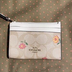 Coach Beige and White Floral Wristlet